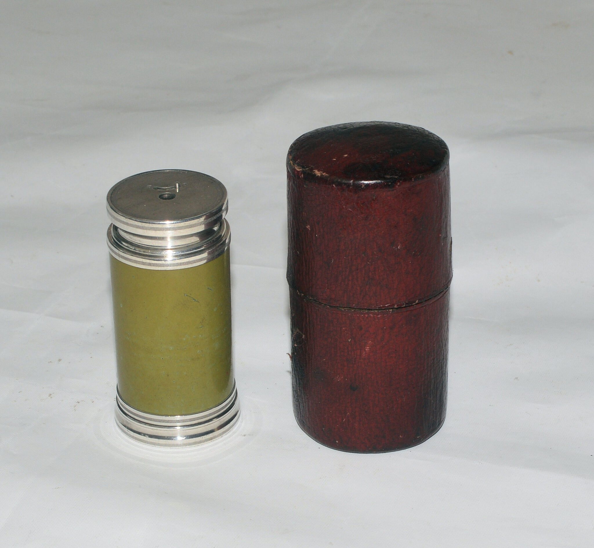 SOLD – Silver variable power monocular telescope and case.