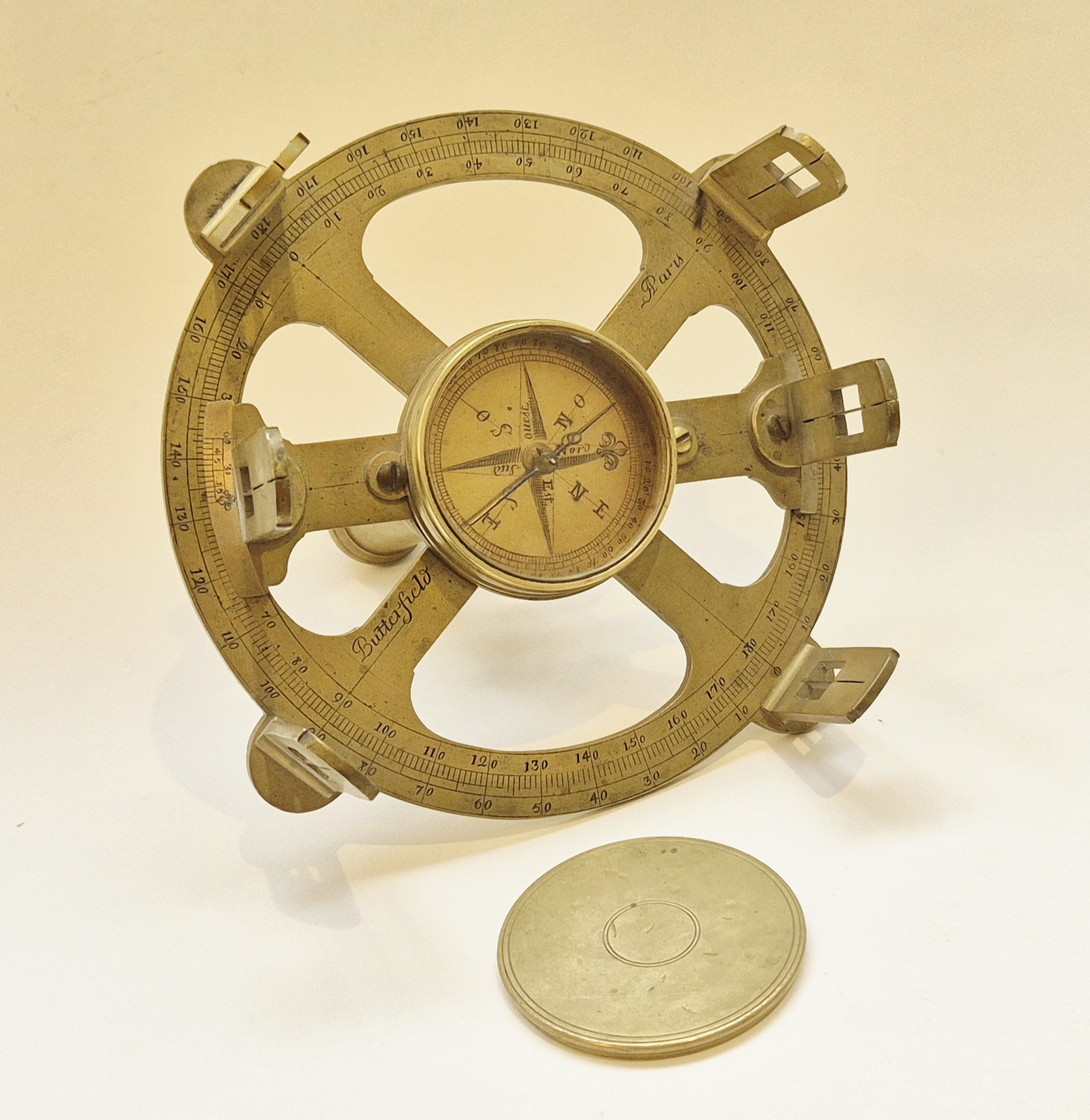 A French brass surveying circle by Butterfield with its original cap, circa 1700